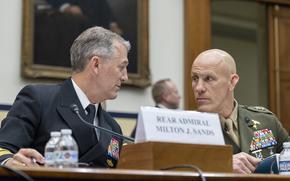 Rear Admiral Lower Half Milton Sands, left, speaks with Major General Peter Huntley on Wednesday, Feb. 26, 2025, before a House Armed Services Committee hearing in Washington. (Eric Kayne/Stars and Stripes)