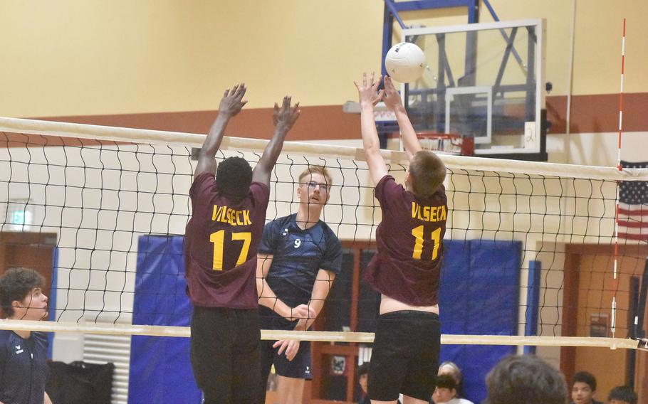 Black Forest Academy's Barney Sivonen watches his spike bounce off the block of Vilseck's Drake Neville as he and teammate Malachi Inniger tried to form a wall Thursday, Oct. 26, 2023 in the DODEA-Europe boys volleyball championships.

Kent Harris/Stars and Stripes