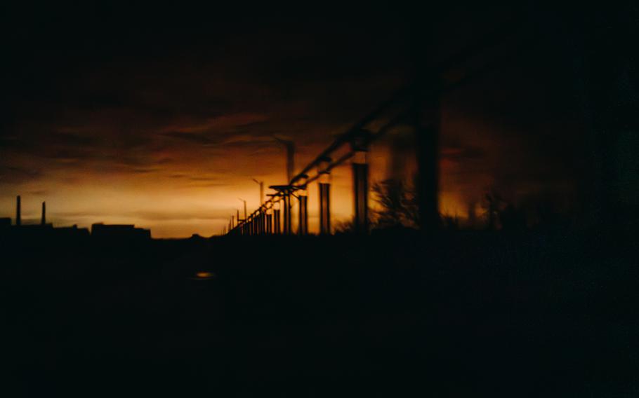 The outline of the Avdiivka coke and chemical plant is seen near Avdiivka on Feb. 6, 2024.