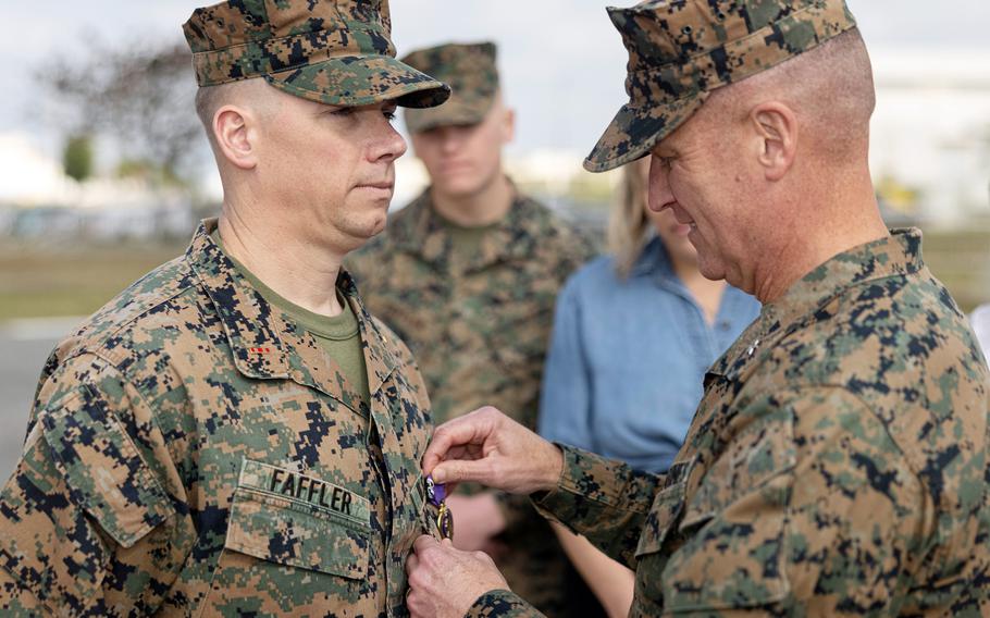 Marine receives an award after his service in Afghanistan.