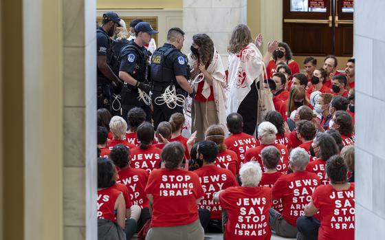 Demonstrators protest against the military policies of Israel in the Cannon House Office Building at the Capitol in Washington on July 23, 2024.