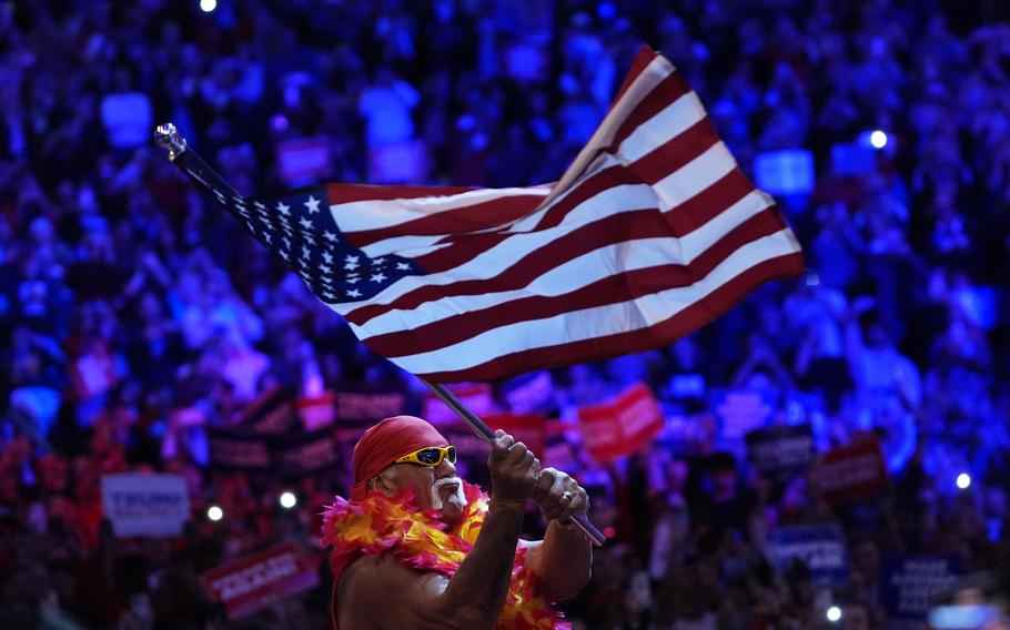 Hulk Hogan waves an American flag at a campaign rally.