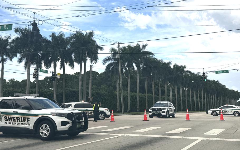 Sheriff’s vehicles are pictured near Trump International Golf Club