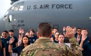 Brig. Gen. Christopher Amrhein, commander of the Air Force Recruiting Service, swears in new recruits at Ramstein Air Base, Germany, on Sept. 12, 2024.