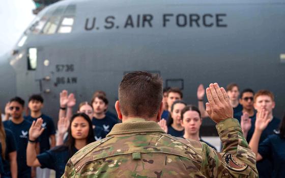 Brig. Gen. Christopher Amrhein, commander of the Air Force Recruiting Service, swears in new recruits at Ramstein Air Base, Germany, on Sept. 12, 2024.