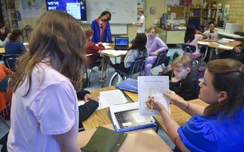 Susan Harris-Boring helps students with their writing