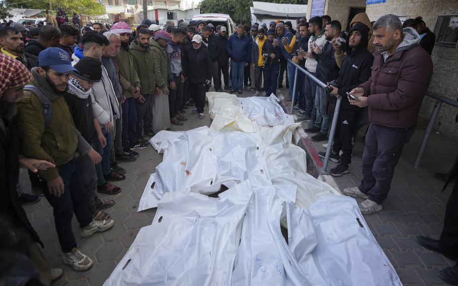 Palestinians attend funeral prayers over the bodies of those killed in overnight Israeli airstrikes on the Maghazi refugee camp, at Al-Aqsa Hospital, in Deir al-Balah, central Gaza Strip, Saturday, Dec. 28, 2024. 