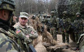 U.S. Army Gen. Christopher Cavoli, NATO’s top military commander and head of U.S. European Command, speaks with allied troops during a visit to Slovakia in March 2024. The U.S. should revive 7th Army in Europe and NATO should make changes to its command structure, a new Atlantic Council report suggested.