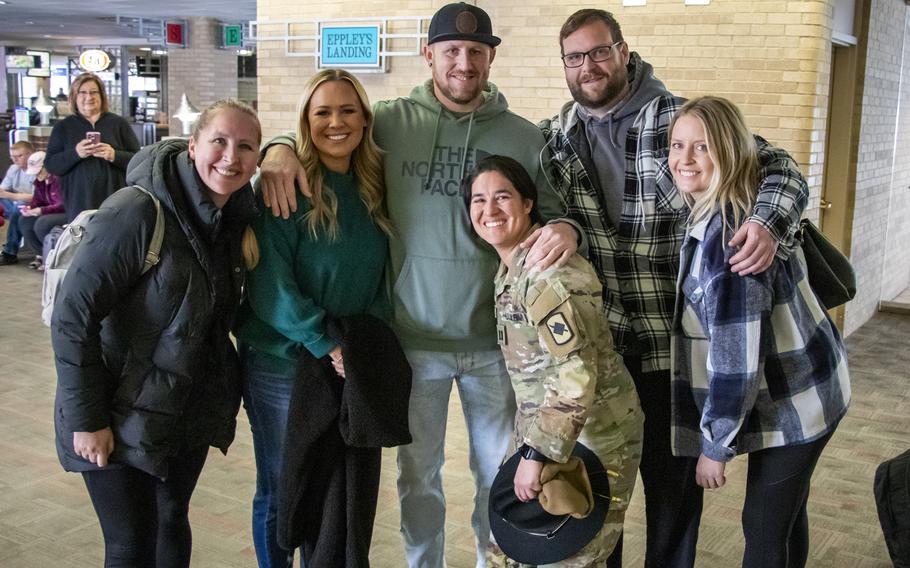 Capt. Ashley Frutos is welcomed home by friends and family Jan. 13, 2024, at Eppley Airfield in Omaha, Neb.