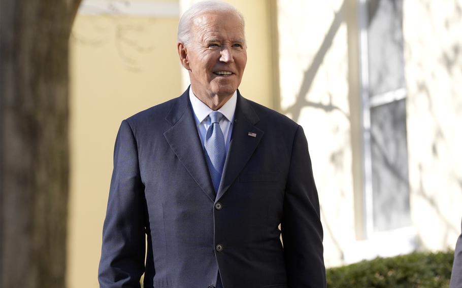 President Joe Biden in a suit and tie on a sunny day.