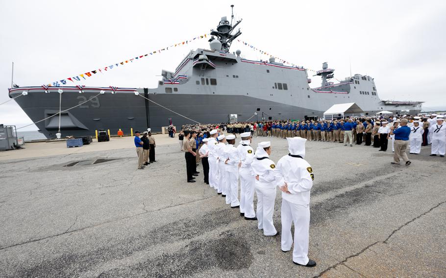 Navy Junior Sea Cadets  and Navy Junior Reserve Officer Training Corps cadets make an arrival line 