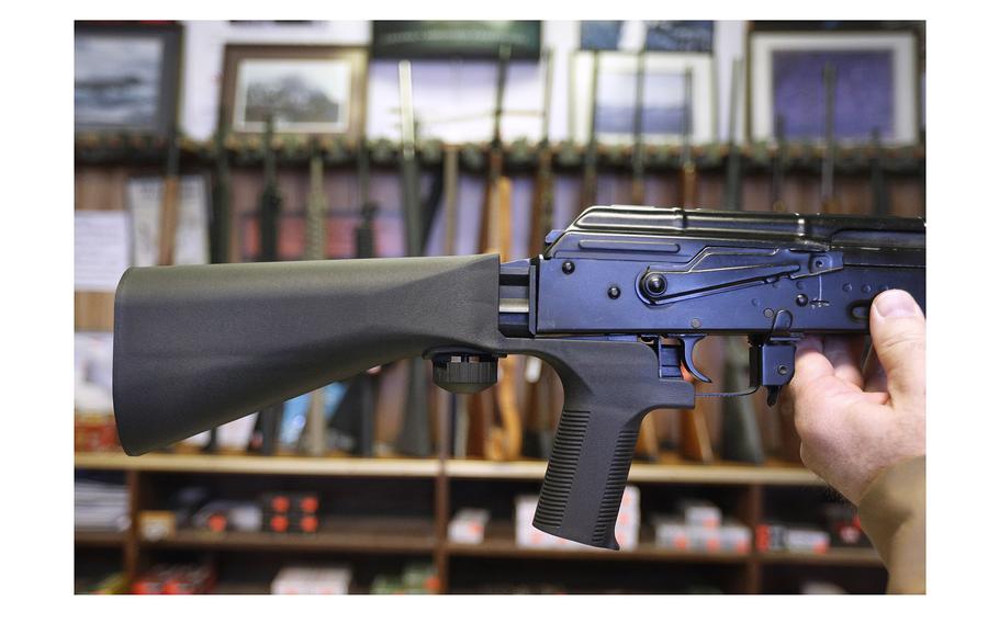 A bump stock device that fits on a semi-automatic rifle to increase the firing speed, making it similar to a fully automatic rifle, is installed on a AK-47 semi-automatic rifle at a gun store on Oct. 5, 2017, in Salt Lake City, Utah. 