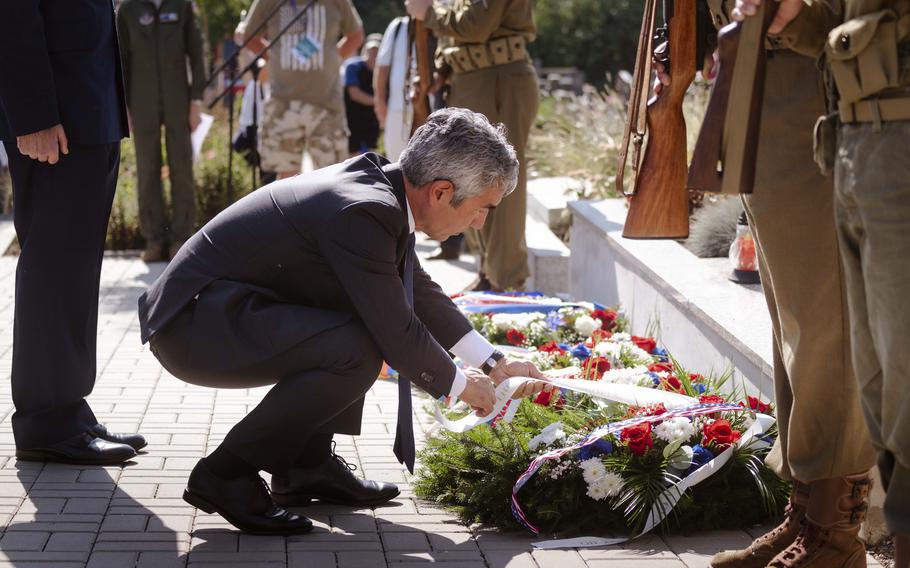 Bijan Sabet, the U.S. Ambassador to the Czech Republic, lays a wreath upon a mass grave site during the 80th commemoration of the Battle over the White Carpathians at Slavicin, Czech Republic, on Aug. 31, 2024.