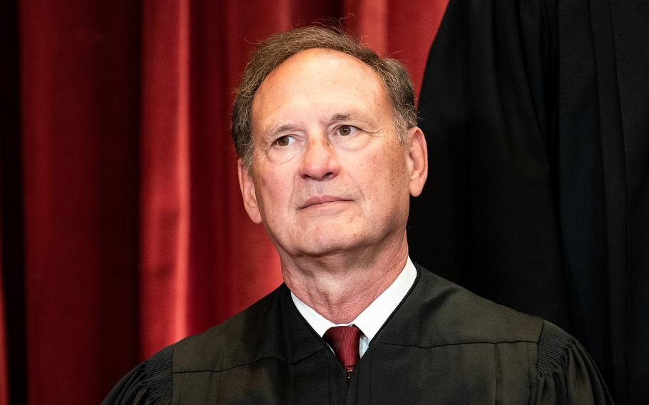 Associate Justice Samuel Alito sits during a group photo of the justices at the Supreme Court in Washington on April 23, 2021. 