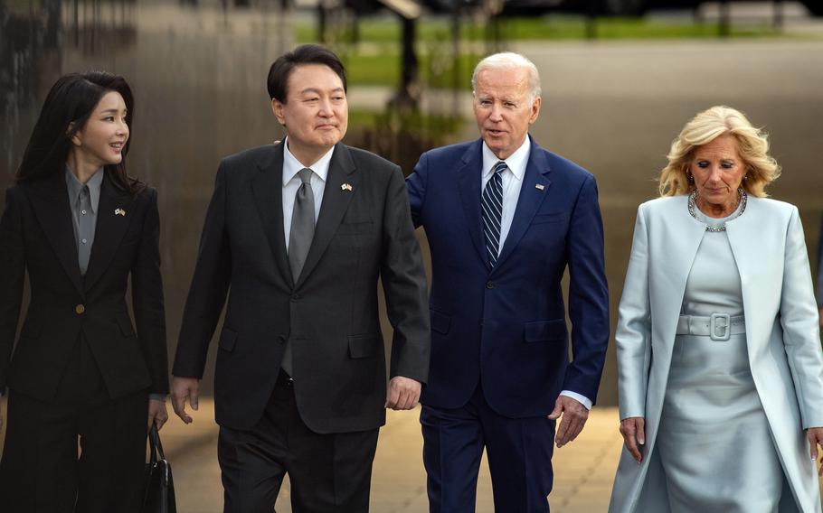 President Joe Biden and first lady Jill Biden walk with South Korean President Yoon Suk Yeol and first lady of South Korea Kim Keon-hee.