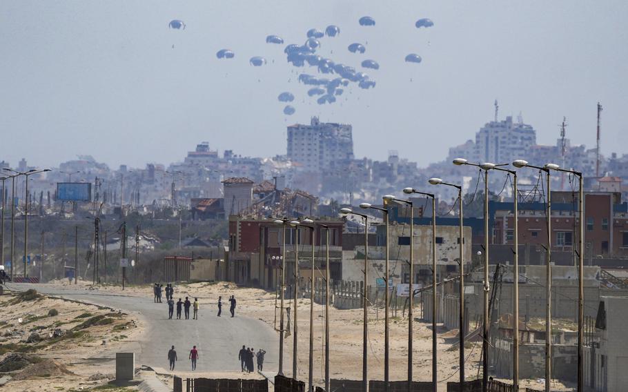 An aircraft airdrops humanitarian aid over the northern Gaza Strip