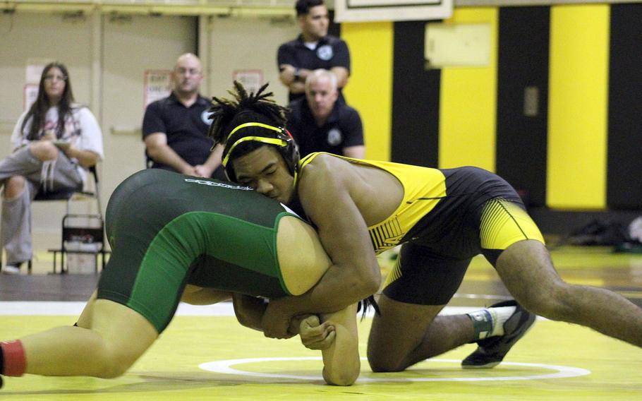 Kadena 189-pounder Tre Shears prepares to gut wrench Kubasaki's Erich Aquino during Wednesday's Okinawa wrestling dual meet. Shears won by technical fall 10-0 in 16 seconds and the Panthers won the meet 40-23, improving to 3-0 over the Dragons this season.