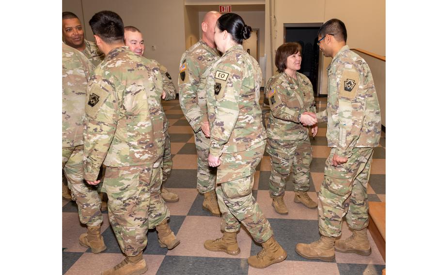 Soldiers shake hands