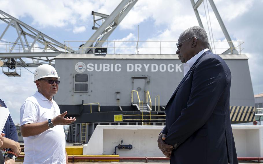 Secretary of Defense Lloyd Austin listens during a tour of Subic Bay in the Philippines.