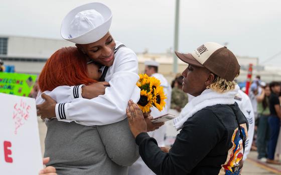 Logistics Specialist Seaman Zion Dunnhedgepeth assigned to the Arleigh Burke-class guided-missile destroyer USS Halsey (DDG 97) reunites with family during the ship's homecoming at Naval Base San Diego, Aug. 16, 2024. The Halsey departed San Diego on Jan. 10, as part of Carrier Strike Group Nine with the USS Theodore Roosevelt, serving as a carrier escort before detaching to conduct operations across multiple warfare areas, providing regional stability and supporting a free and open Indo-Pacific. (U.S. Navy photo by Mass Communication Specialist 2nd Class Maria G. Llanos)