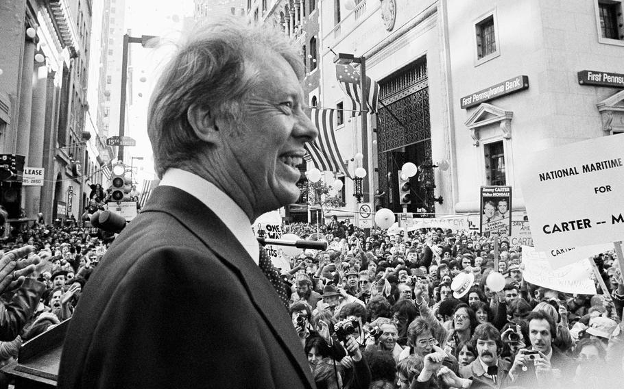 Jimmy Carter stands in front of a crowd in October 1976.