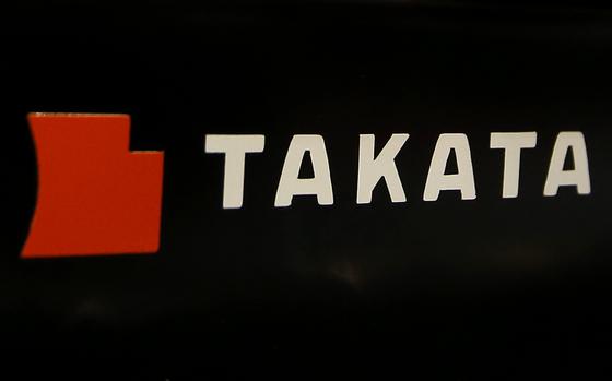 FILE - The logo of Takata Corp. is displayed at an auto supply shop in Tokyo, July 6, 2016. (AP Photo/Shizuo Kambayashi, File)