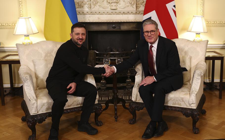 Britain’s Prime Minister Keir Starmer, right, greets Ukraine’s President Volodymyr Zelenskyy, left, for a meeting at 10 Downing Street in London, England, Saturday, March 1, 2025. 