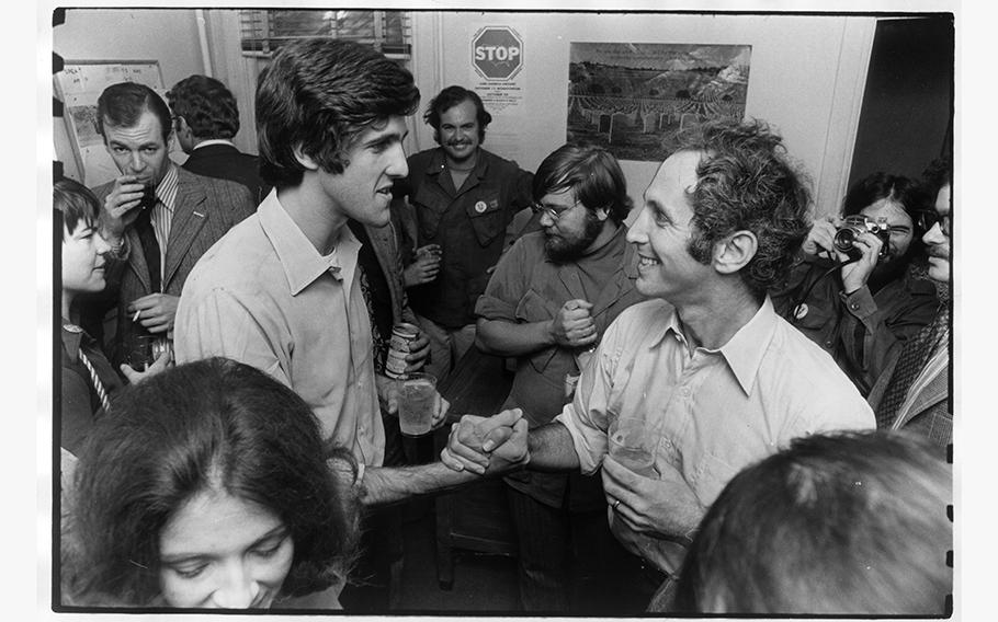 Antiwar activist John F. Kerry, who later served as a U.S. senator and secretary of state, shakes hands with Daniel Ellsberg at a Washington meeting in 1971. 