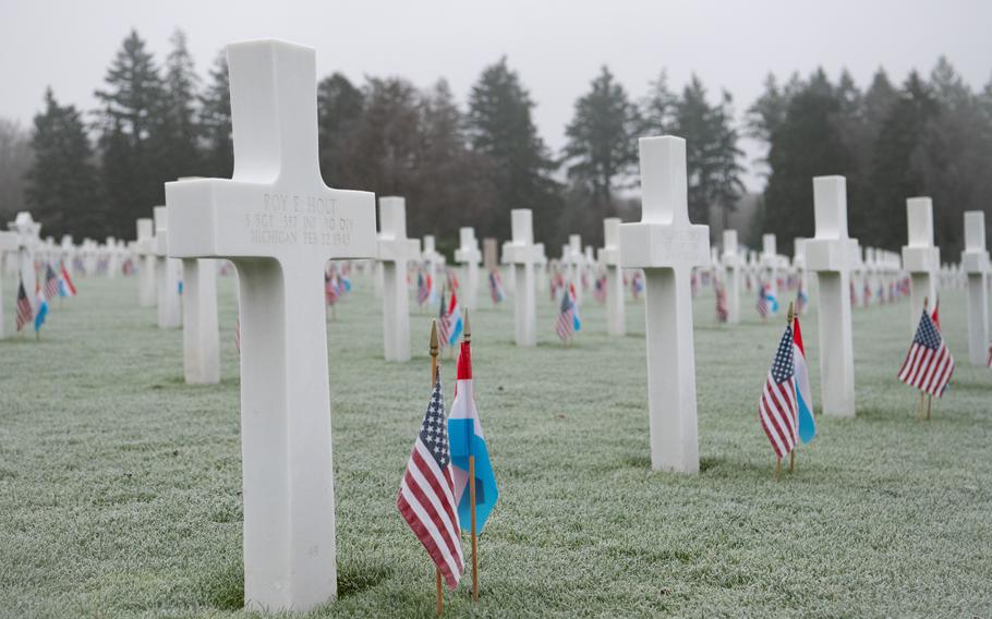 Frost-covered graves at Luxembourg American Cemetery, in Hamm, Luxembourg, are decorated with American and Luxembourgish flags, Dec. 14, 2024. More than 5,000 U.S. service members are buried at the cemetery, many of whom died during the Battle of the Bulge.