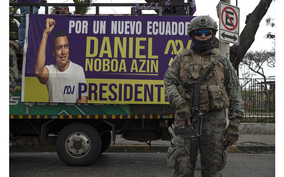 A military officer stands guard during a campaign rally for Daniel Noboa in Guayaquil, Ecuador, in October 2023.