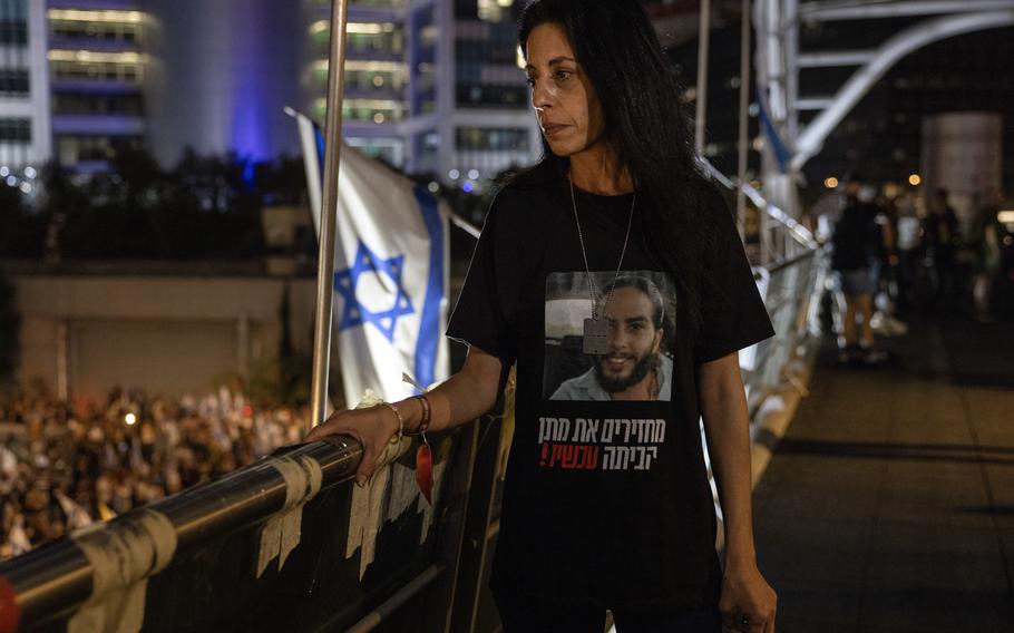 Zangauker watches tens of thousands of protesters during an anti-government demonstration in Tel Aviv on June 22. 