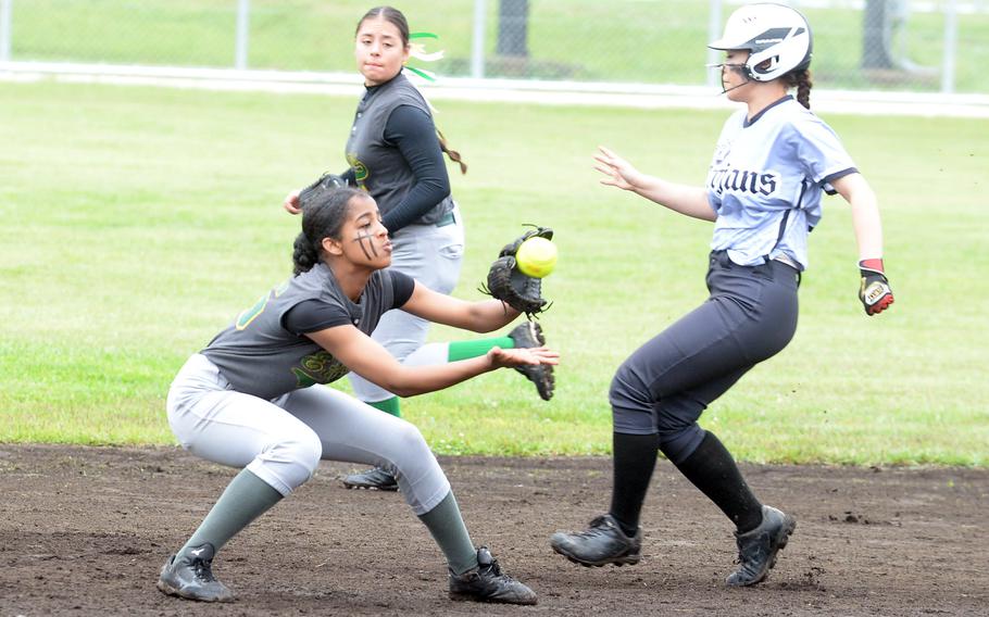 Edgren shortstop Kurtisey Chase tries to take the throw and tag Zama baserunner Erika Farley during Tuesday's Division II softball tournament. The Eagles won 9-7 and earned the No. 3 seed enteering Thursday's playoffs.
