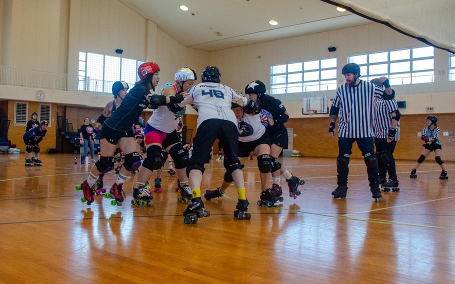 The Vampires and Werewolves roller derby teams compete inside Purdy Gym at Yokosuka Naval Base, Japan, June 17, 2023.