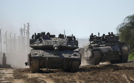 Israeli troops are crossing into Israel from the Gaza Strip, Saturday, Jan. 18, 2025. (AP Photo/Tsafrir Abayov)