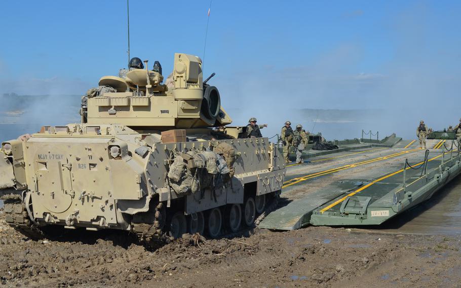 A Bradley Fighting Vehicle is loaded onto a bridge at Fort Cavazos, Texas, on Nov. 3, 2023, as part of a division-level training exercise.