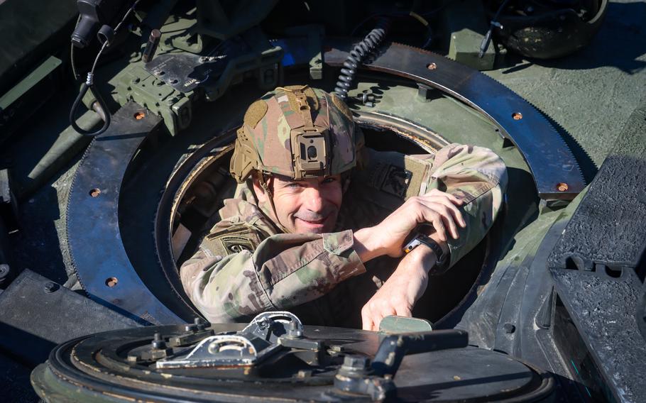 U.S. Army Lt. Gen. Christopher T. Donahue peers out of a tank while visiting troops in the Grafenwoehr Training Area of Germany, March 22, 2022. 