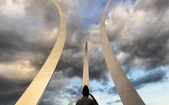 An Airman renders a salute during the playing of the National Anthem at the Air Force Memorial in Arlington, Va., Sept. 17, 2019. The Air Force Memorial, standing at 270 feet tall, honors the legacy of the past and present service members in the United States Air Force. (U.S. Air Force photo by Airman 1st Class Taryn Butler)