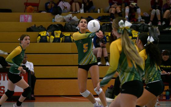 Alconbury senior Sofia Politis bumps the ball while teammates watch during a match against Ansbach in pool play of the Division III DODEA European championships on Oct. 31, 2024, at Kaiserslautern High School in Kaiserslautern, Germany.