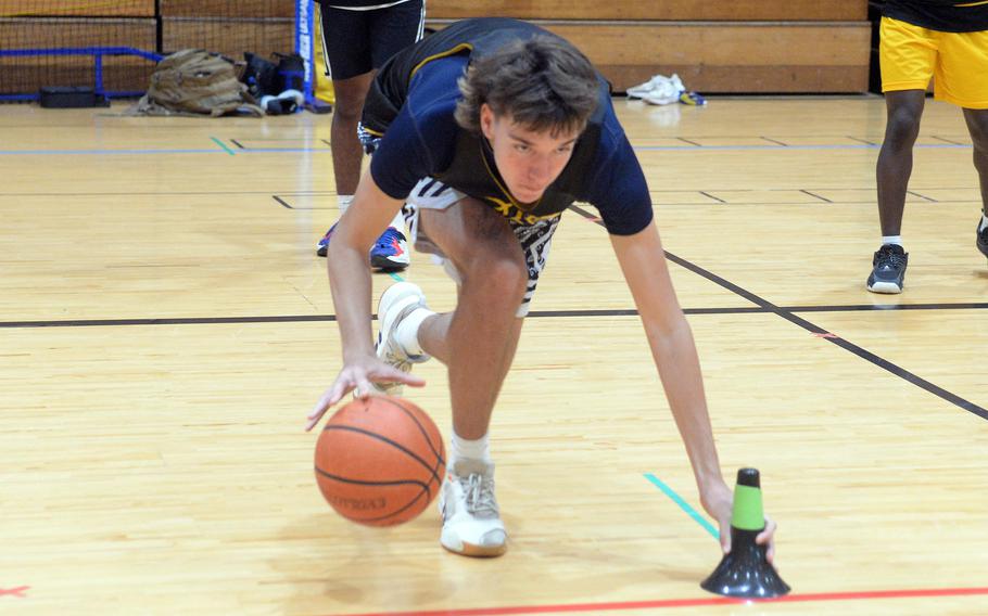 Mark Francis dribbles low during a practice.