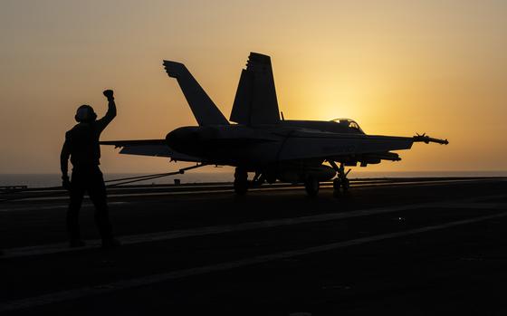 A fighter jet lands on the USS Dwight D. Eisenhower in the Red Sea on June 11, 2024.
