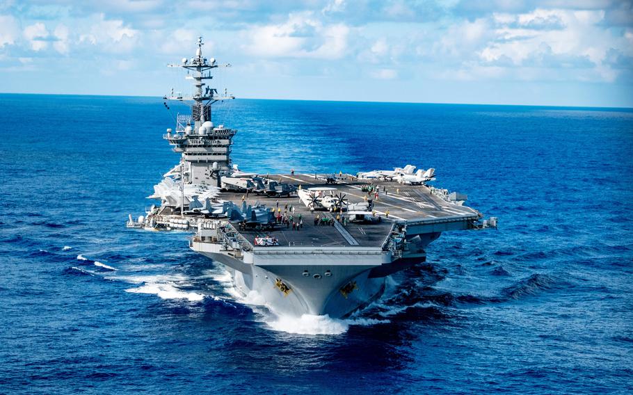 The aircraft carrier USS George Washington transits through the sea.