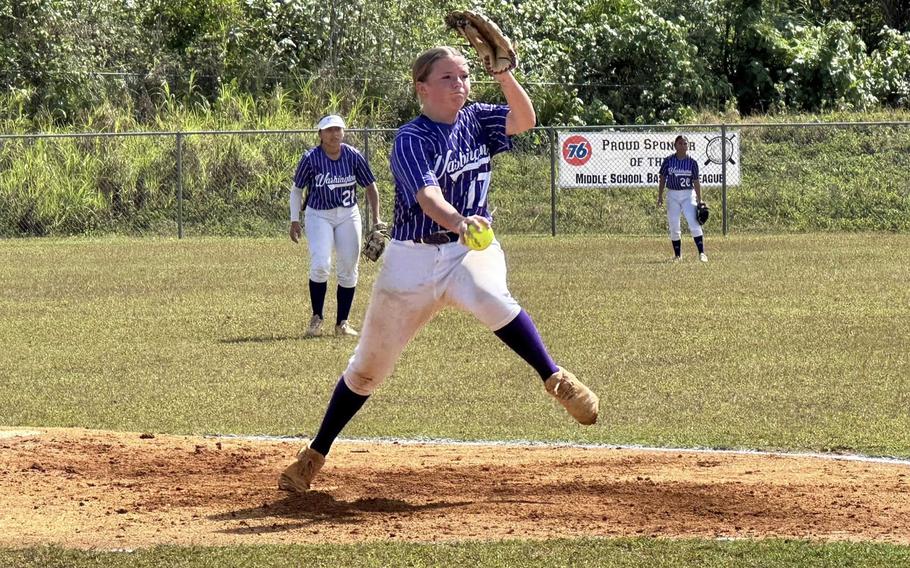 Brinnlyn Hardt winds up to throw to the plate.