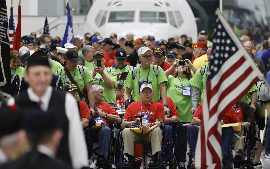 Veterans line up for a parade. Honor Flight Syracuse welcomes home 80 veterans on Mission 18 at Syracuse Hancock Internal airport, Syracuse, N.Y., April 22, 2023. 