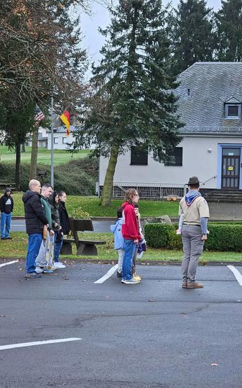 Scouts in the Exhcange parking lot, looking onto the ceremony at the memorial