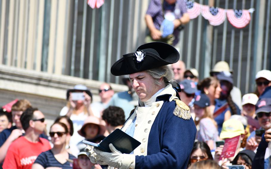 A reenactor portraying President George Washington reads the Declaration of Independence on the steps of the National Archives on July 4, 2024.