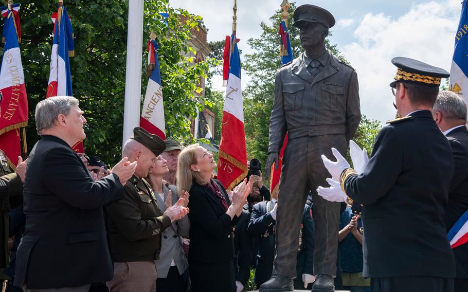 From left, Mark Milley, retired general and former chairman of the Joint Chiefs of Staff, NATO supreme allied commander in Europe Gen. Christopher Cavoli and Susan Eisenhower help unveil a statue of Dwight D. Eisenhower in Sainte-Mère-Église, France, Monday, June 3, 2024.
