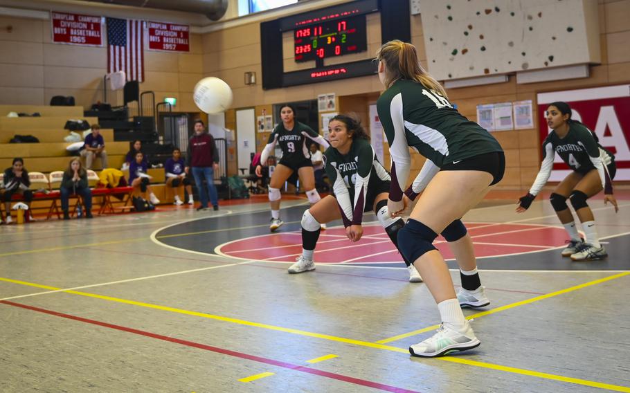 AFNORTH Lion Bella Benedeto executes a center dig, skillfully maneuvering the ball during the DODEA Division III European volleyball semifinals on Oct. 27, 2023, in Kaiserslautern, Germany.