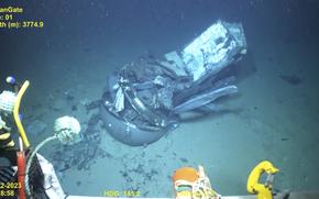 This June 2023 United States Coast Guard still frame from video provided by Pelagic Research Services, shows remains of the Titan submersible, center, on the floor of the Atlantic Ocean. (U.S. Coast Guard Video courtesy Pelagic Research Services via AP)