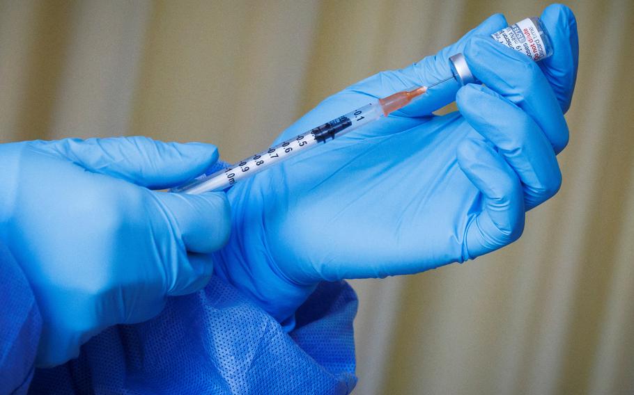 A nurse prepares a vaccine shot as the German embassy begins its roll out of BioNTech COVID-19 vaccines for German expatriates at a Beijing United Family hospital in Beijing, China, in January 2023.