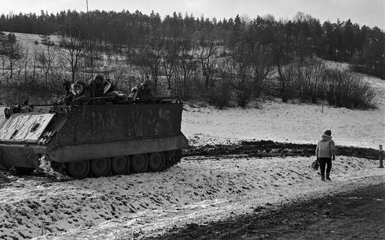 HED: Don't mind us, 1969

Near Vilseck, Germany, Feb. 3, 1969: A women walks through the snow past an M113 taking part in the Carbide Ice exercise. "Blue Forces" battled "Orange Forces" in the Grafenwoehr - Vilseck area during the multi-day exercise, part of Reforger I, as locals went about their day. Both 24th and 19th Infantry Division took part in the "battle."

Read the 1969 story on the exercise and check out additional photos here.
https://www.stripes.com/history/2023-03-08/reforger-debut-germany-1969-9402523.html

META TAGS: Reforger; Reforger 1; NATO; exercise; training; Crested Cap; Air Force; Army; USAREUR; servicemember; soldier; dual exercise; training; Carbide Ice; snow; Cold War; locals; civilians; M113 APC; Armored Personnel Carrier